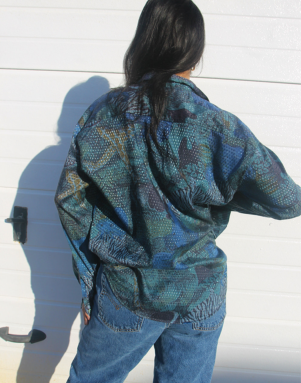 woman wearing vintage blue long sleeve shirt