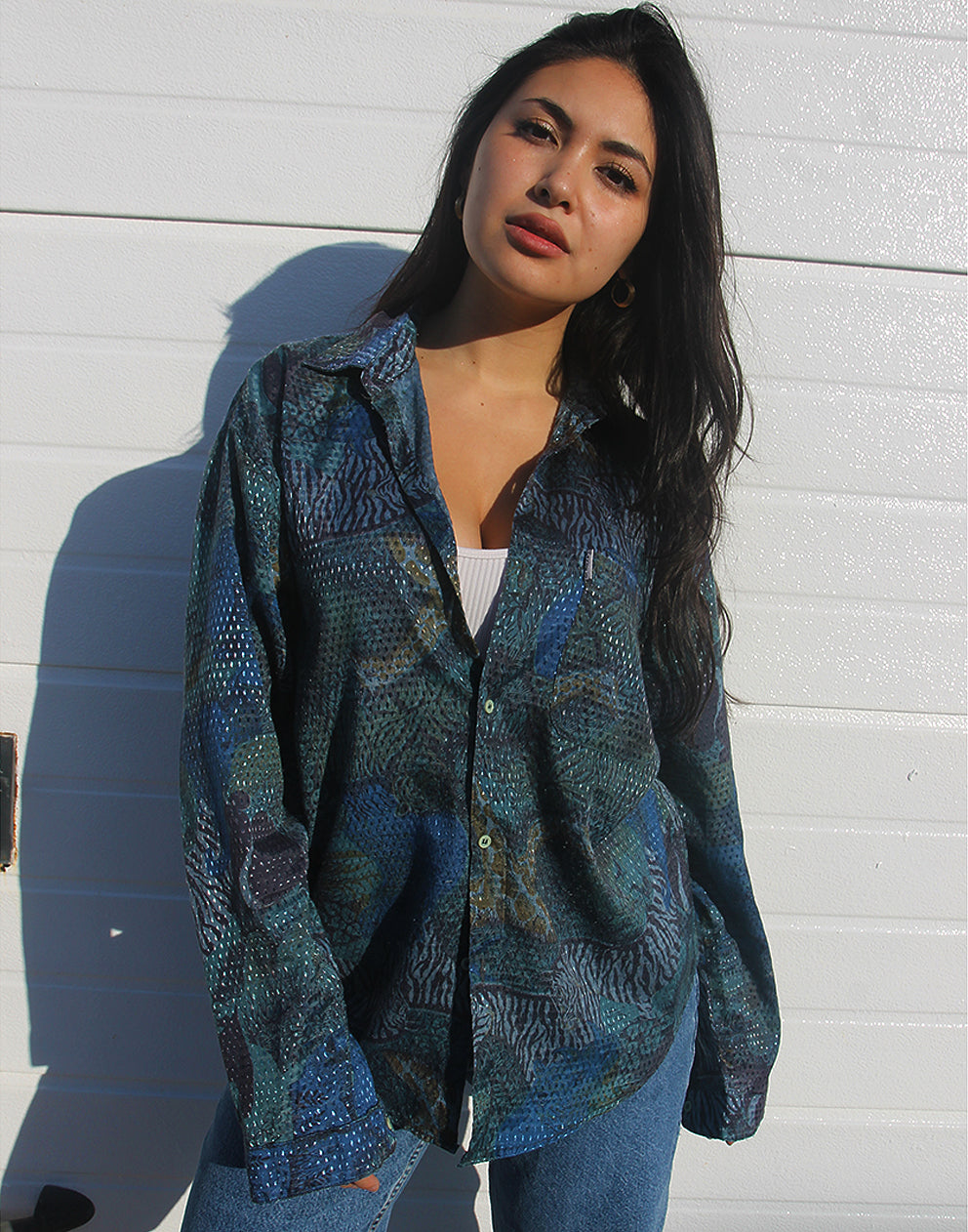 woman wearing blue abstract print long sleeve vintage shirt